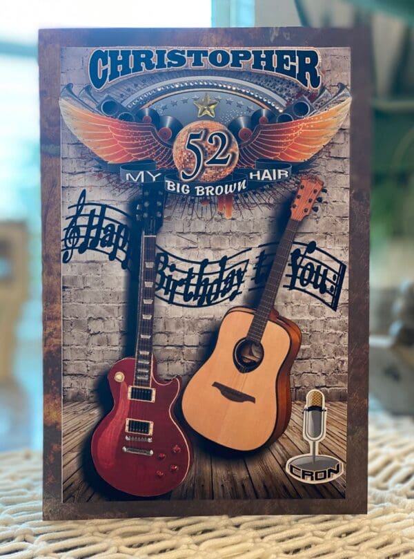 A card with guitars and a microphone on it.