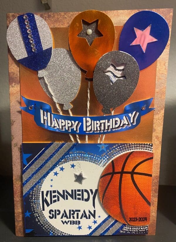 A birthday card with balloons and basketball on it.