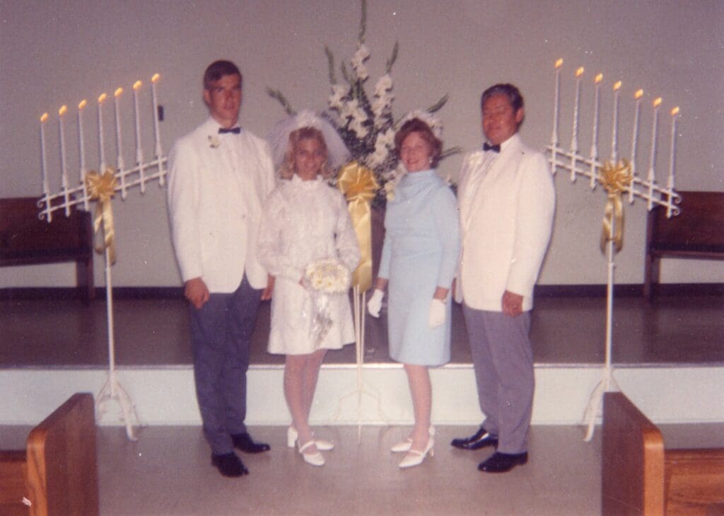 Wedding ceremony with bride, groom, and guests.